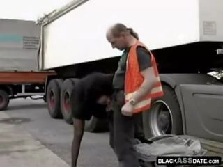 Black streetwalker riding on full-blown truck driver outside