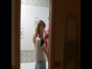 Skinny schoolgirl masturbating on the toilet