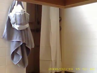 Spying beguiling 19 year old young woman showering in dorm bathroom